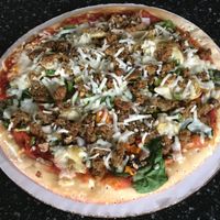 Take-and-bake "Veggie Delight" pizza with plant-based meat (after baking at home) at The Mac Shack & Specialties in Red Wing