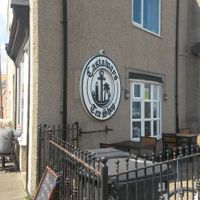 Exterior and outside seating at Castaways Tea Shop in Seaton Sluice
