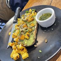 Avocado toast.. brilliant and extremely tasty twist with butternut squash, almond ricotta and pepitas!  at Buena Onda Cafe in St Augustine