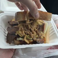 Brisket (Cole slaw and fried onion rings on the sandwich). It is massive!!! at The Joint Vegan Street Food in Colorado Springs