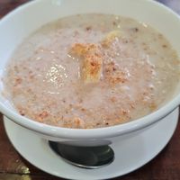 Oatmeal with banana, shredded coconut and almond milk. at Nang Sabai Cafe Artisan Bakery in Koh Samui