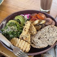 Custom brekkie with tempeh*2, tomatoes and onions, kale, avocado, mushrooms, sourdough bread   at Nang Sabai Cafe Artisan Bakery in Koh Samui