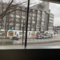View out the window. Lots of signs out front to point the way.  at Vegan Bistro Jangara in Tokyo