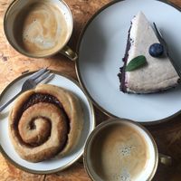 Cake and cinnamon roll to go at Südlicht Cafe in Cologne