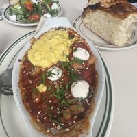 Eggs in purgatory with focaccia and side salad  at Stefano's Diner in Toronto