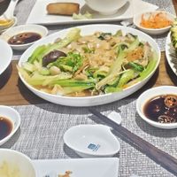 Left: Lemongrass fried tofu, Middle: flat noodles and vegetables in mushroom sauce, Right: pineapple fried rice at San May in Phu Quoc