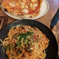 Puttanesca spaghetti and ham and pineapple pizza at Nolita in Wellington