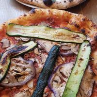 Umami pizza with veggie toppings and Mia (pistachio) pizza at Marcus Pizze Amore in Paris