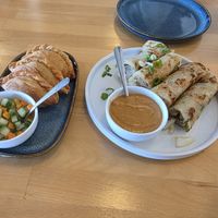 Curry puffs and Onion pancakes with peanut sauce. at Somewhere In Bangkok in Southington