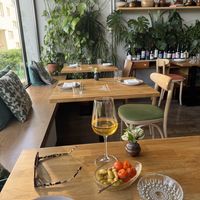 Dogwood “olives” with roast cherry tomatoes and local rough cider  at Zrodlo in Warsaw