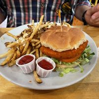 The vegan Buffalo unchicken sammy with garlic fries.  at Golden West Cafe in Baltimore