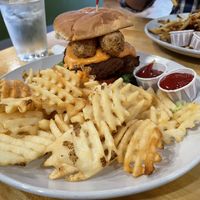 The vegan chick’n Supremo with waffle fries. The sandwich has vegan  mozzarella sticks on it. It was very good. I would order it again.  at Golden West Cafe in Baltimore