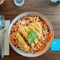 Thai salad with rice noodles, breaded vegetable strips, raw vegetables, and peanut sauce. at Les Herbes Folles in Dourdan