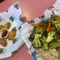 Veggie dumplings & Asian Veggies w/brown rice!👍🏼👍🏼  at Eliza's Vegan Café in Florence