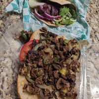 Cheese steak and a raw veggie pita at Eliza's Vegan Café in Florence