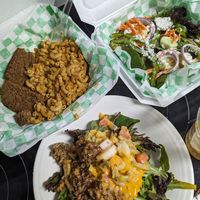 Cheeseburger in a cup, poured out on the plate. Mac and cheese with meatloaf, raw veggie pita at Eliza's Vegan Café in Florence