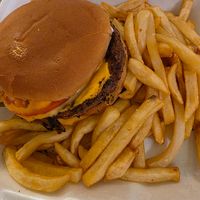 Double cheeseburger and fries at Eliza's Vegan Café in Florence