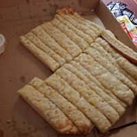 Vegan cheese bread minus a few pieces 😜 at Toppers Pizza in Rochester