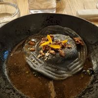 Raviolo met miso-pompoen en in koffie geroosterde knolselderijbouillon at Kasvio in Utrecht