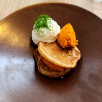 Buckwheat blinis with carrot tartar (fermented with Koji) and sour cream at Kasvio in Utrecht