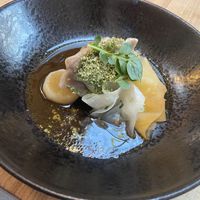 Main course: rye dough dumplings filled with seitan and nettle, served with turnip and hempseed in a kombu/mushroom jus. Tasty. at Kasvio in Utrecht