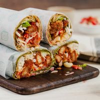 Criollo V-Wrap: Soy chicharroncitos (peruvian tipical pork food) mixed with tomato, onions, corn,  yellow chili pepper, white cabbage with a sauce called acevichada (normally used in our tipical ceviche). All wrapped in the seed tortilla. at V-Wraps in Lima