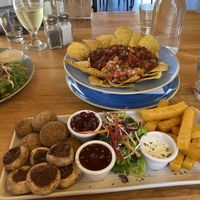 Nachos (top) and vegetarian falafel platter made vegan.Unsure if the dip on the right was even actually vegan. Staff checked and said it was, so benefit of doubt and all… but YMM at Stumpers Bar & Cafe in Hokitika