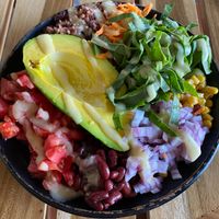 Veggie bowl with avocado, red o Jon, beans, Gallo pinto, spinach, corn, carrots, and tomatoes  at Verde in Granada