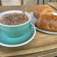 Vegan chai latte and croissant and pain chocolat   at Land & Monkeys - Pernety in Paris