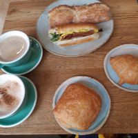 Bacon sandwich, mediteran sandwich, croissant, pain au chocolate, cappucino & chai at Land & Monkeys - Pernety in Paris