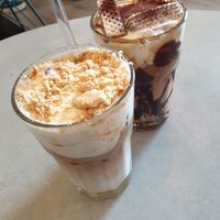 Cheesecake Latte with biscuit crumbles any Tiramisu Latte with chocolate syrup (both vegan and delicious!) at Coffea in Berlin