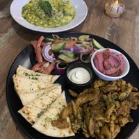 Pesto, gnocchi  & shawarma platter with hummus, and Israeli salad   at PiANTA in Providence