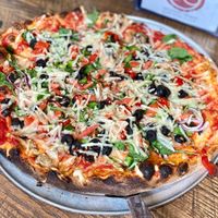 Veggie Pizza with vegan cheese that we brought at dO wood fired in Irwin