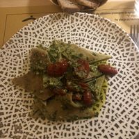Testaroli con PESTO VEGAN DI BASILICO, RUCOLA E AVOCADO CON POMODORINI CONFIT   at Zenzero in Bologna