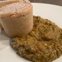 Appetizer - Azifa - 
Whole lentils cooked and mashed, blended with onions, jalapeño peppers, horseradish, vegetable oil, lemon juice, and a hint of garlic served with injeera at Taste of Ethiopia in Austin