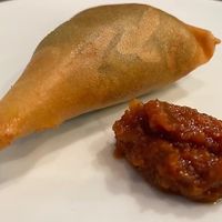 lentils, or spinach in a lightly crusty pastry dough seasoned with diced onions, jalapeño peppers, and vegetable oil. (One order - 2 pieces) Fantastic! at Taste of Ethiopia in Austin