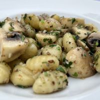 Gnocchi in olive oil garlic and  parsley   at El Drac al Cau del Llop in Girona