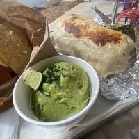 Vegan burrito (crispy) w. potatoes added, guac and chips  at Boca Grande in Columbia