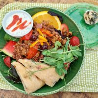 Salad with walnuts, sundried tomatoes, quinoa, watermelon, strawberries, tomato, foaccacia bread, etc. at Tant Grön in Vintrosa