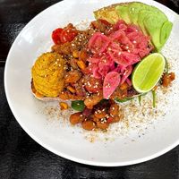 Vegan spiced beans - with harissa hummus, avocado & pickled onion on sourdough at remy's in Paddington