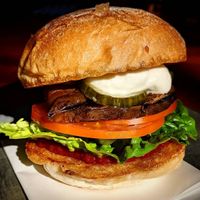 Vegan Eggplant Burger - grilled eggplant, lettuce, tomato, relish, pickle, vegan aioli at remy's in Paddington