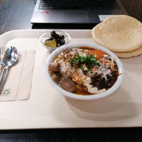 Hummus meal with mushrooms, pitta, olives, black beans.  at Coworking Lounge Tessinerplatz - Coffee Shop in Zurich
