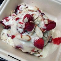 Lemon frosting, raspberries, raspberry drizzle with almonds. ❤️ at Cinnaholic in Arlington