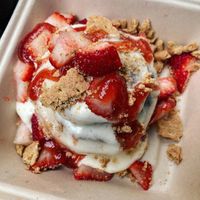 Cream cheese frosting, strawberries, strawberry drizzle and Graham crackers.  at Cinnaholic in Arlington