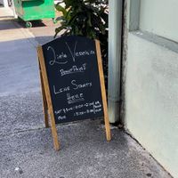 Sign by mud hen water  at Little Vessels Donut Co in Honolulu