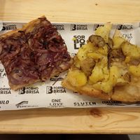 Breakfast focaccias with onions and potatoes at Forno Brisa - Via Galliera in Bologna