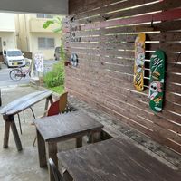 outside sitting area (there’s another table tough)  at Rotton 六屯 in Chatan