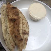 Tahini and pita on the side   at Miznon in Central Singapore