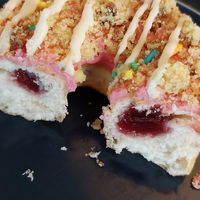 Birthday cake doughnut has jam filling at Kommune - Food Court in Sheffield