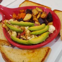 Venice Beach tofu scramble - tofu, roasted red peppers, onions, artichokes, avocado slices, salsa w/ twisted taters & sourdough toast at Twisted Citrus in North Canton